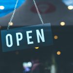 selective focus photography of open signage